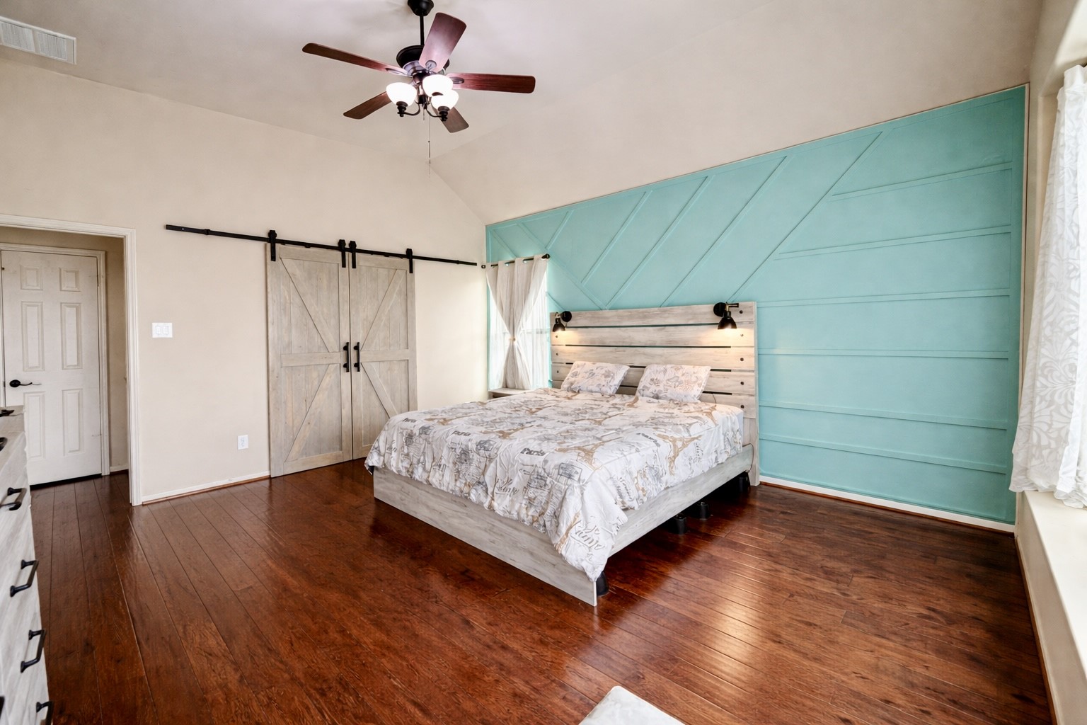 29011 Powder Ridge Drive Katy, TX 77494 - Photo 12 of 25 a bedroom with a bed chandelier and a window