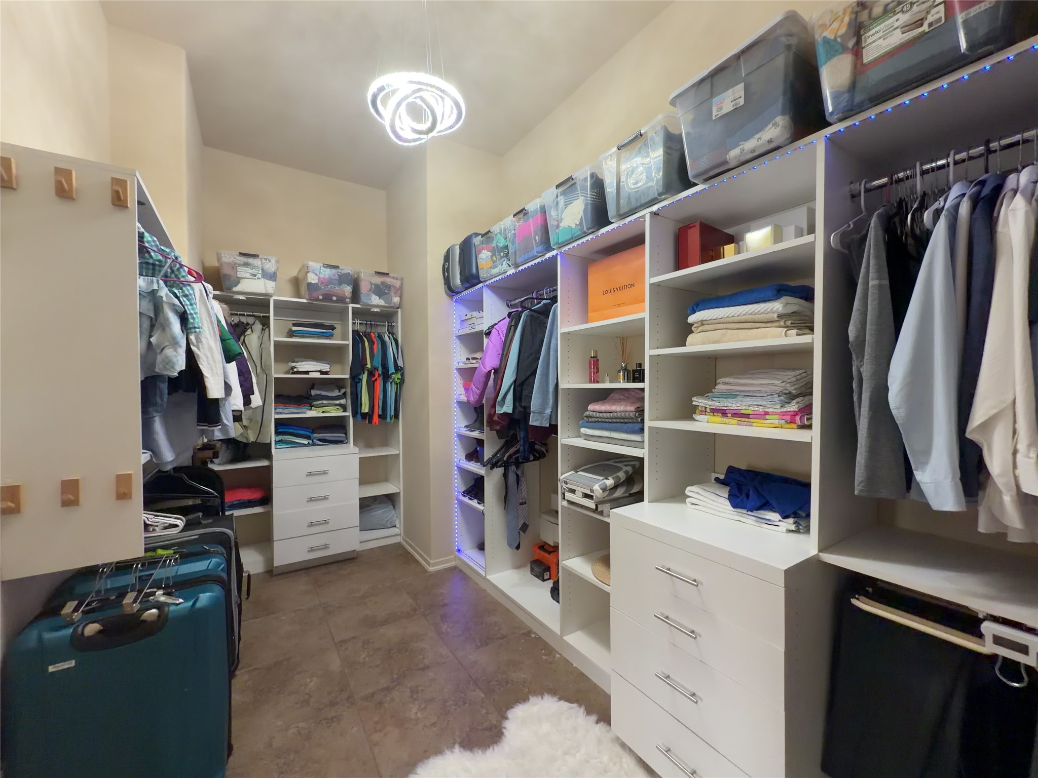 29011 Powder Ridge Drive Katy, TX 77494 - Photo 17 of 25 a view of walk in closet with clothes and shoes