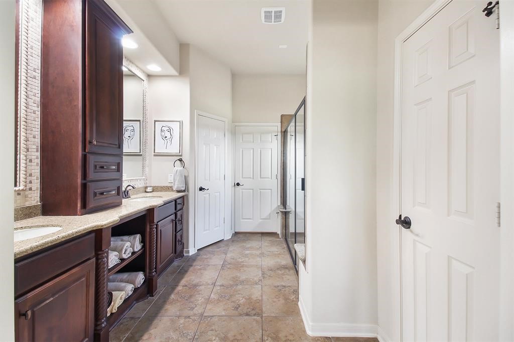 29011 Powder Ridge Drive Katy, TX 77494 - Photo 24 of 25 a large bathroom with a double vanity sink and a mirror