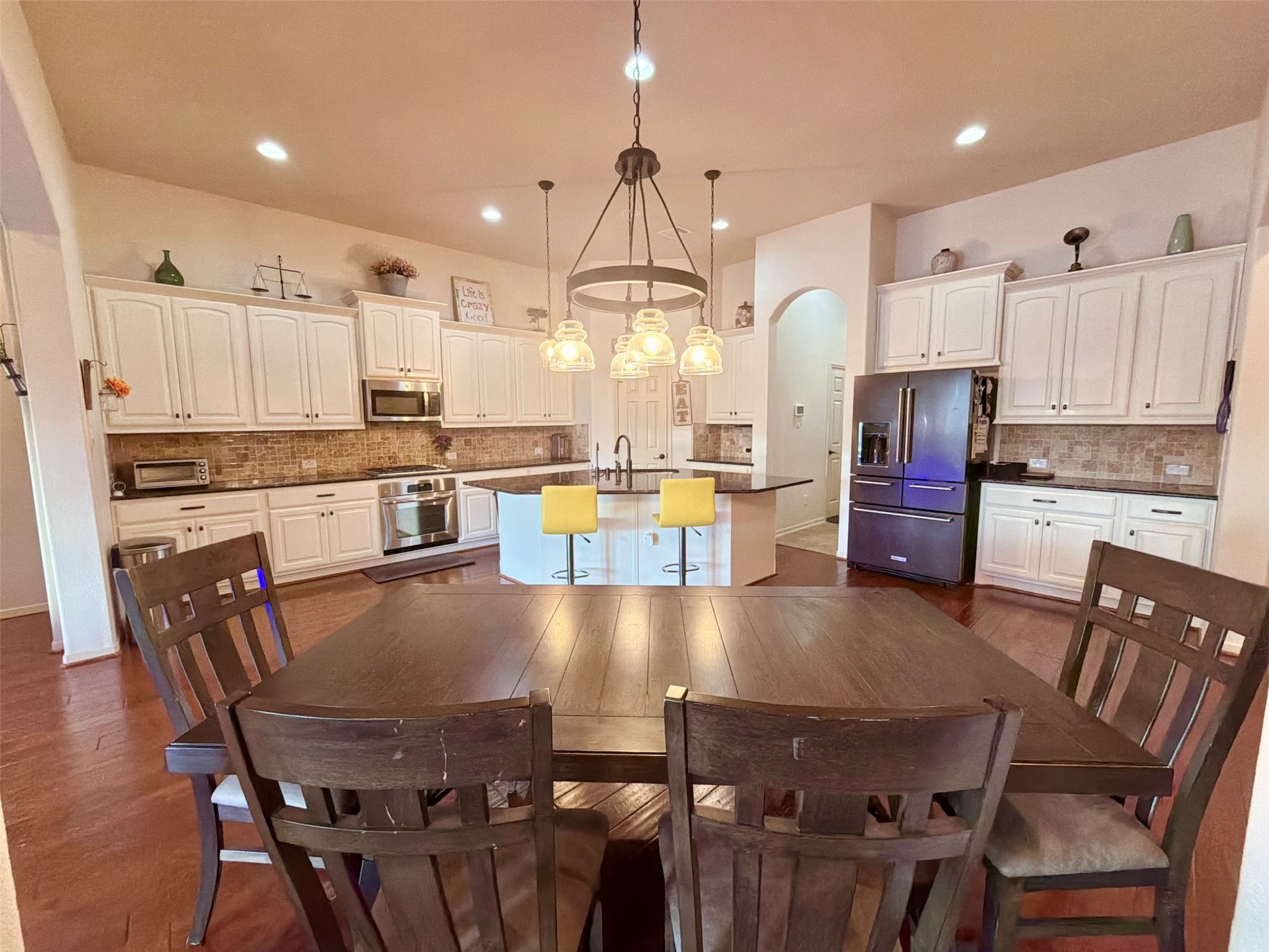 29011 Powder Ridge Drive Katy, TX 77494 - Photo 6 of 25 a large kitchen with a table and chairs