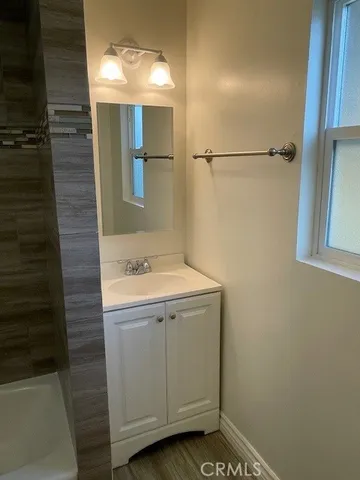 a bathroom with a sink and a mirror