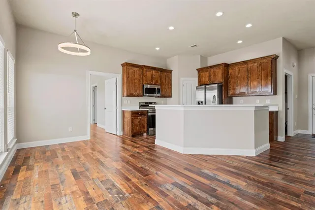 a view of a kitchen with microwave and cabinets