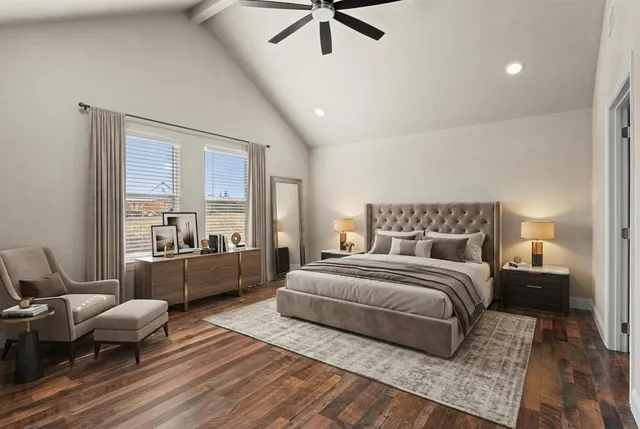 a spacious bedroom with a bed a couch and a window