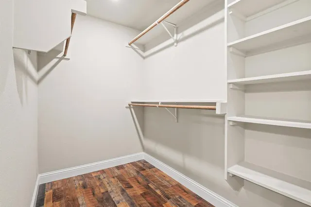 a view of an empty walk in closet