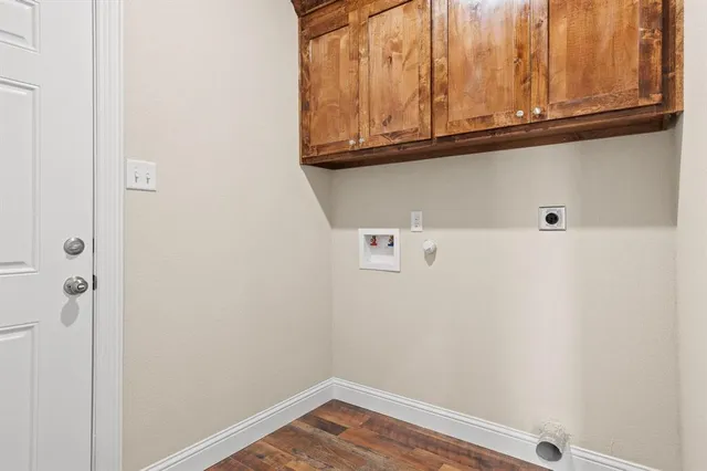 a view of door with cabinets