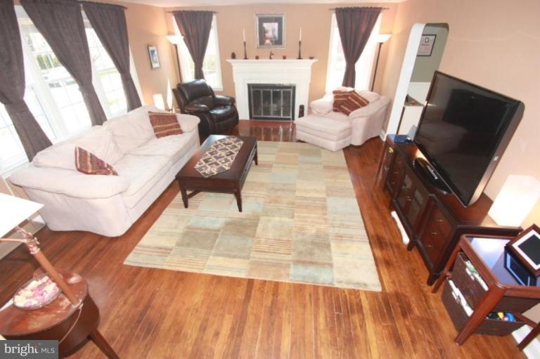 1581 Dellsway Road Towson, MD 21286 - Photo 14 of 30 a living room with furniture fireplace and flat screen tv