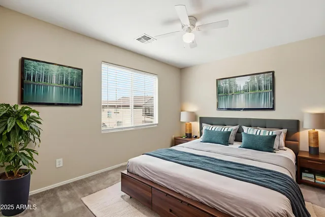 a bedroom with bed and window