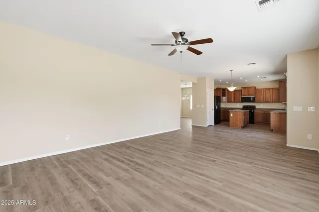 a view of a kitchen with a sink and stainless steel appliances