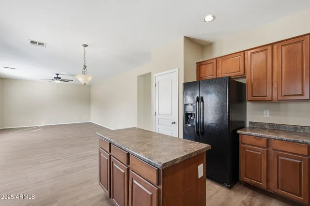 a kitchen with stainless steel appliances granite countertop a sink stove and microwave
