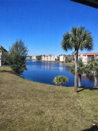 a view of a lake with a yard
