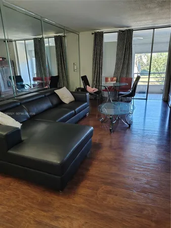 a bedroom with a bed and a lamp