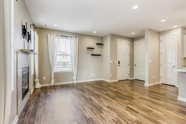 a view of livingroom with furniture wooden floor and window