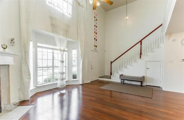 a view of entryway with wooden floor and stairs