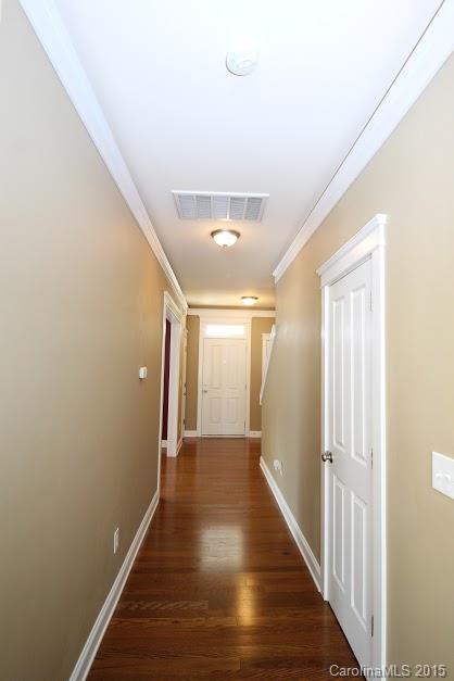 14058 Stumptown Road Huntersville, NC 28078 - Photo 7 of 14 a view of a hallway with wooden floor