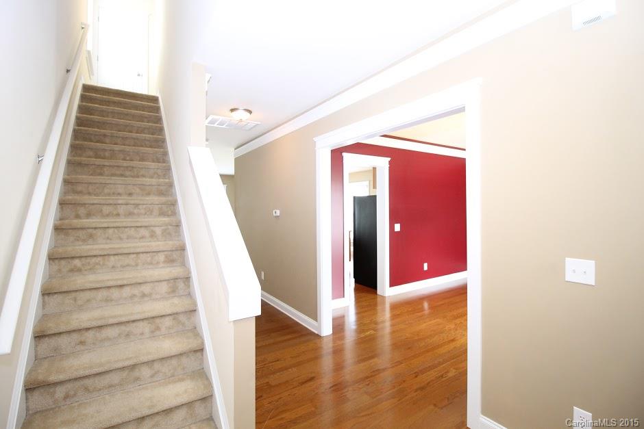 14058 Stumptown Road Huntersville, NC 28078 - Photo 8 of 14 a view of a hallway with staircase