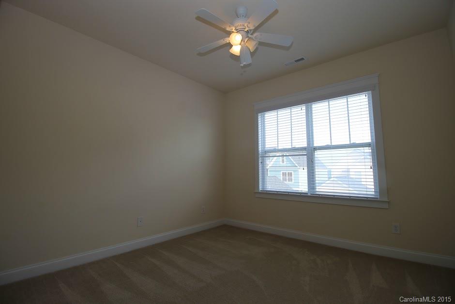 14058 Stumptown Road Huntersville, NC 28078 - Photo 9 of 14 an empty room with a window