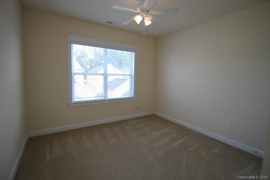 14058 Stumptown Road Huntersville, NC 28078 - Photo 10 of 14 an empty room with a window