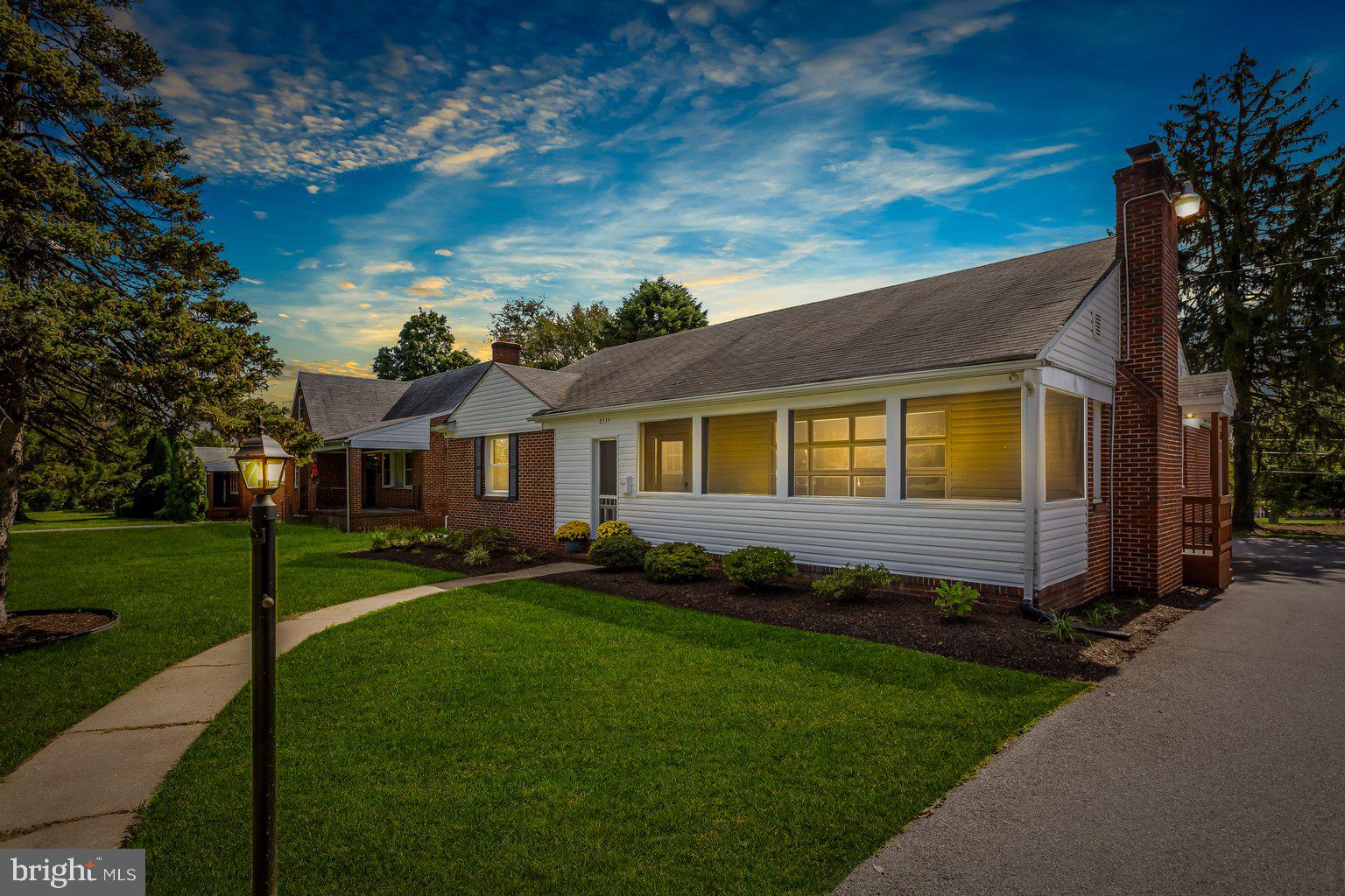 8335 Liberty Road Windsor Mill, MD 21244 - Photo 1 of 57 a front view of a house with a garden