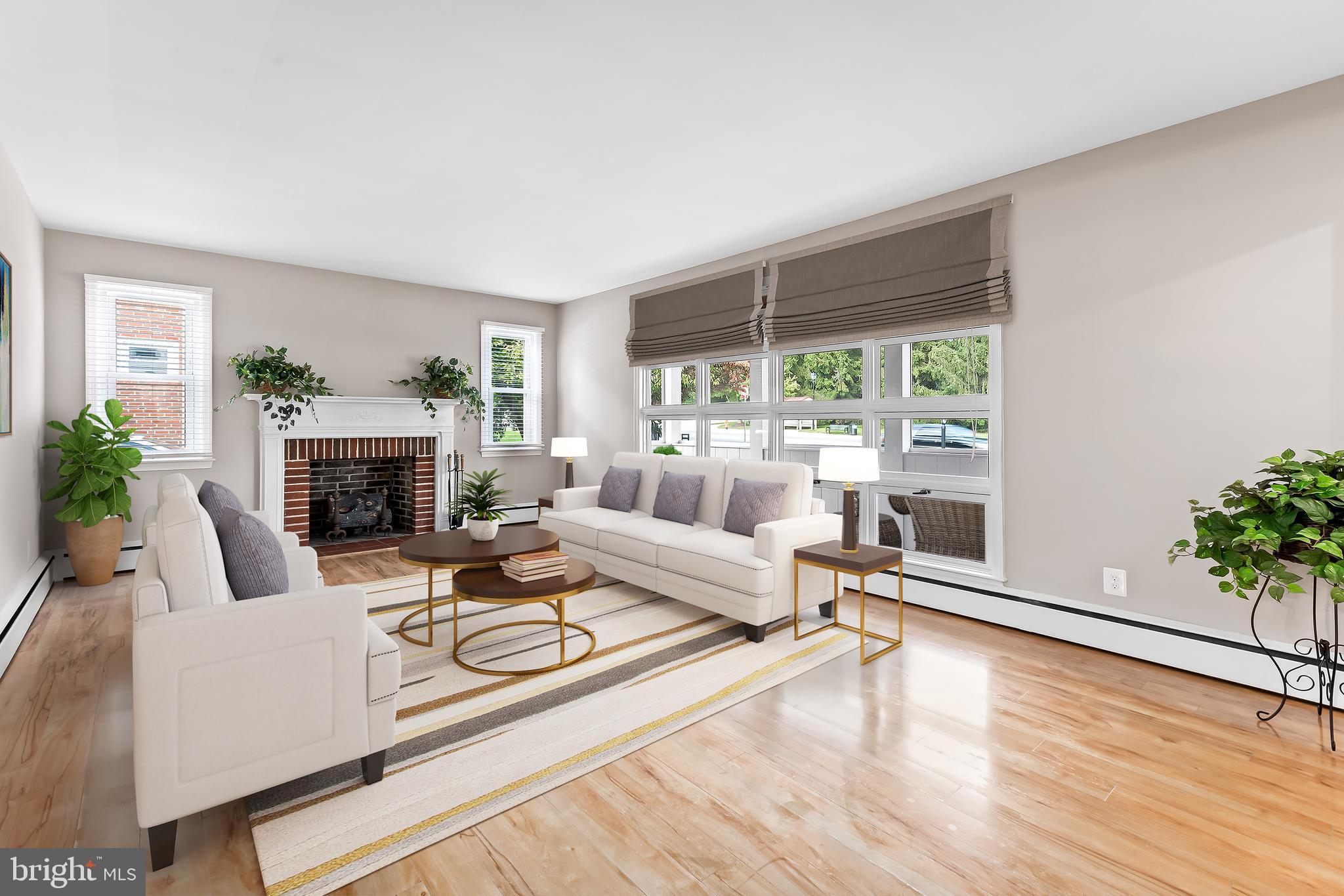 8335 Liberty Road Windsor Mill, MD 21244 - Photo 11 of 57 a living room with furniture large window and a fireplace