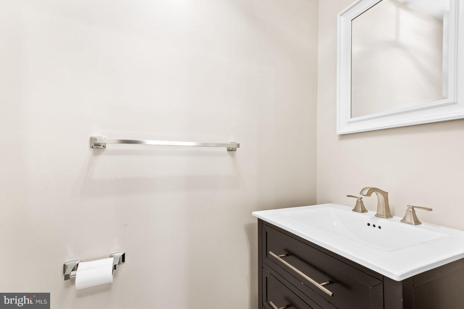 8335 Liberty Road Windsor Mill, MD 21244 - Photo 24 of 57 a bathroom with a sink and a toilet
