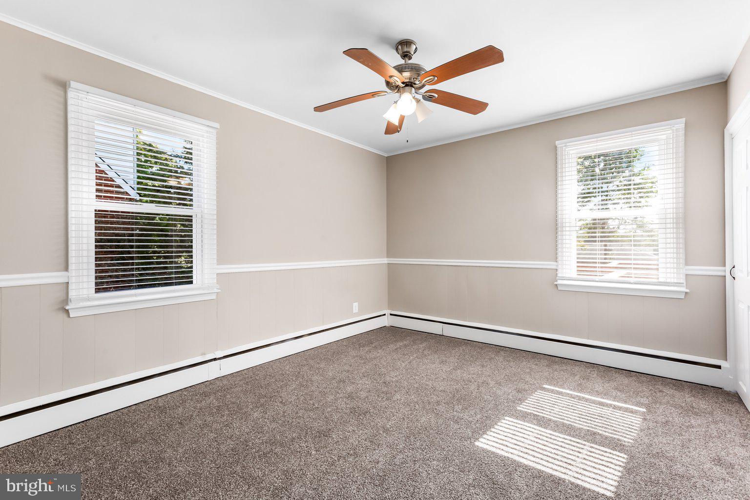 8335 Liberty Road Windsor Mill, MD 21244 - Photo 25 of 57 an empty room with windows and fan