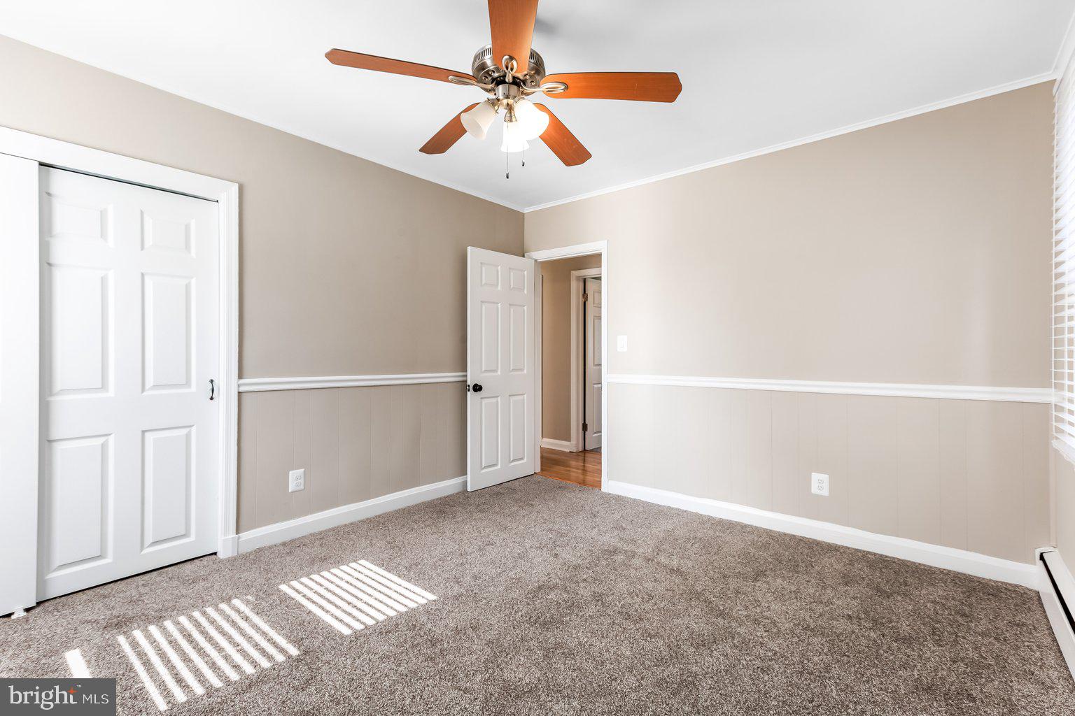8335 Liberty Road Windsor Mill, MD 21244 - Photo 26 of 57 an empty room with closet and fan