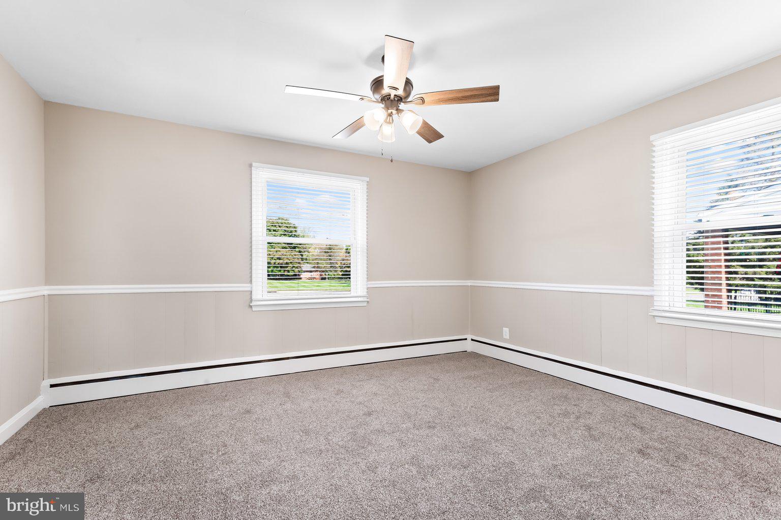 8335 Liberty Road Windsor Mill, MD 21244 - Photo 31 of 57 an empty room with windows and fan