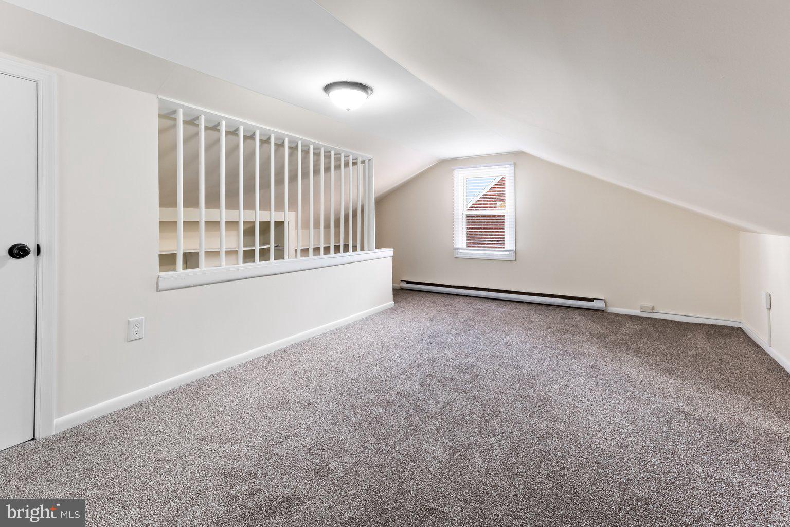 8335 Liberty Road Windsor Mill, MD 21244 - Photo 35 of 57 an empty room with a window and stairs