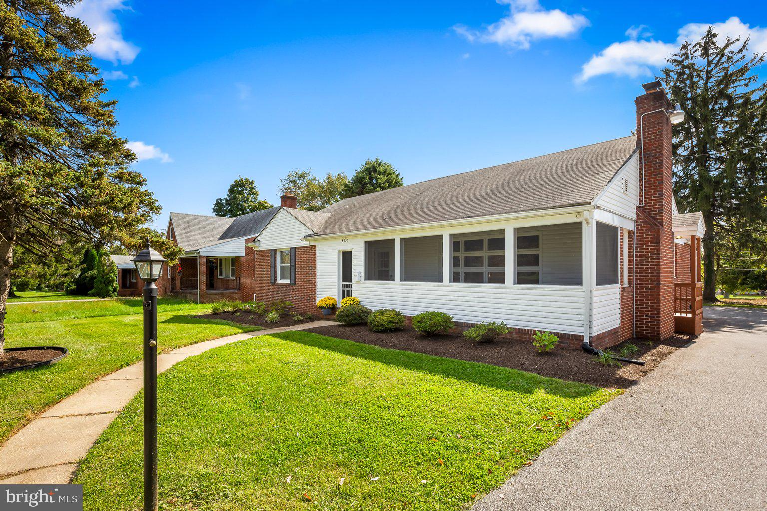 8335 Liberty Road Windsor Mill, MD 21244 - Photo 4 of 57 a front view of a house with garden