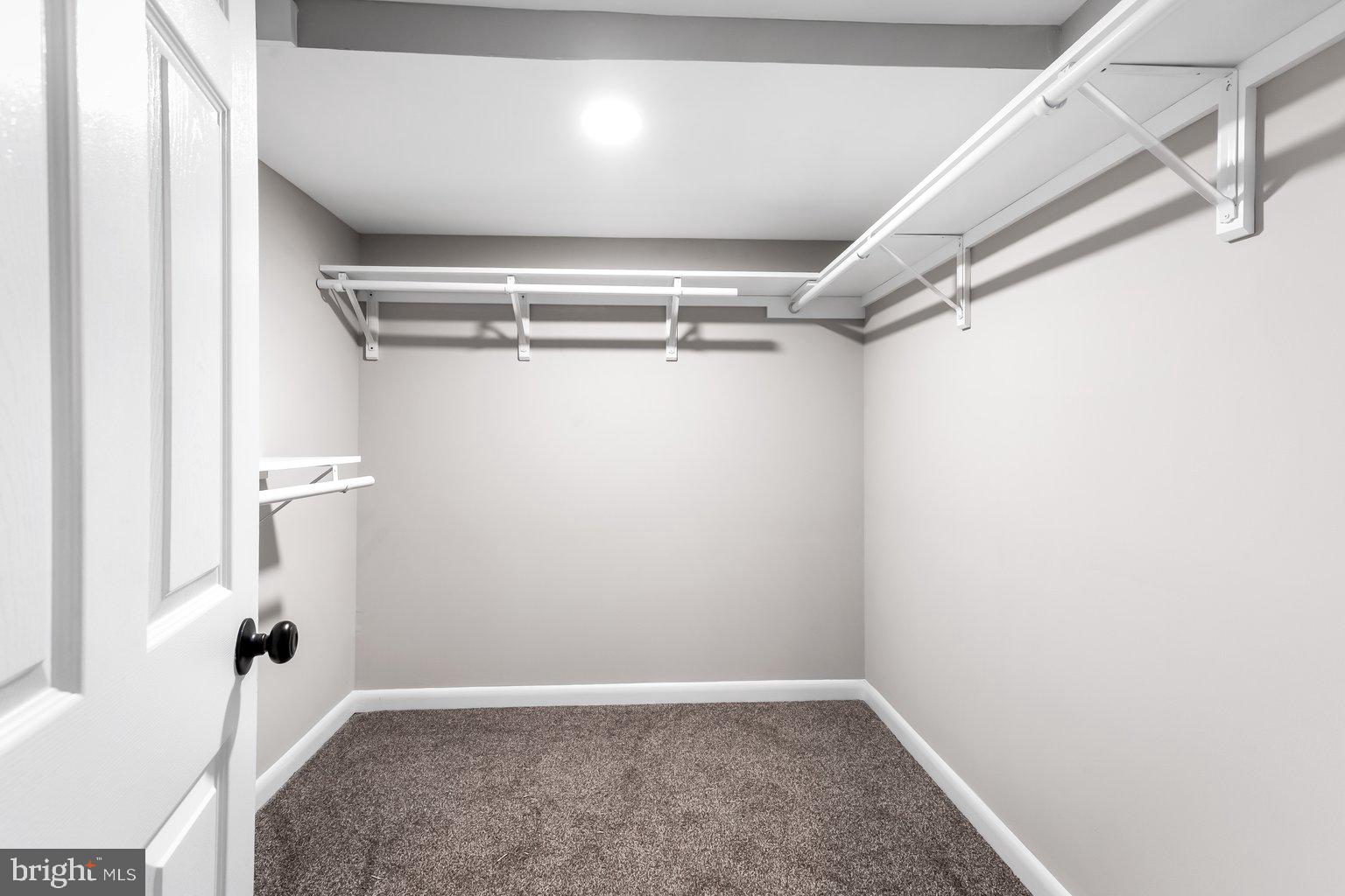 8335 Liberty Road Windsor Mill, MD 21244 - Photo 46 of 57 a view of walk in closet with empty racks