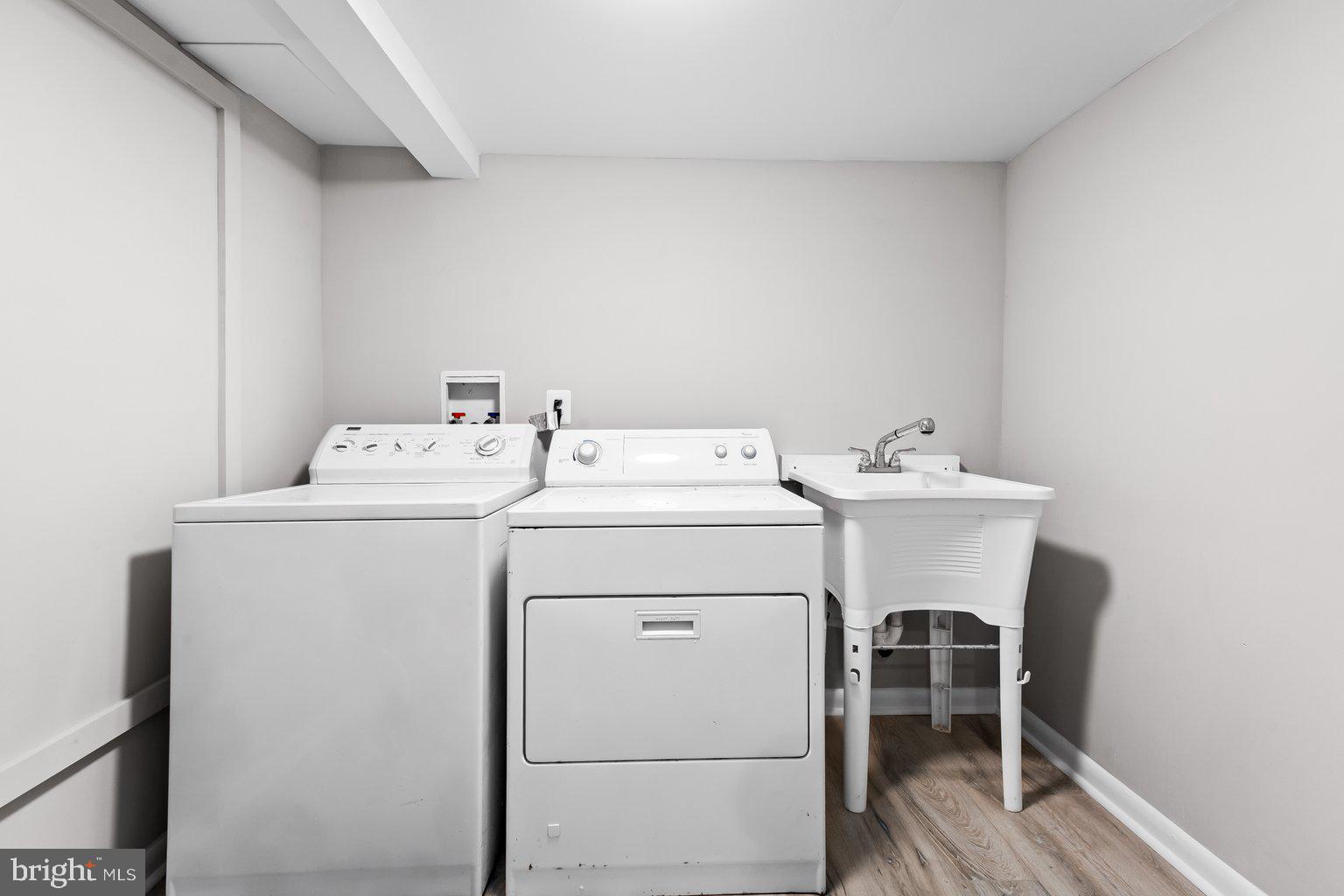 8335 Liberty Road Windsor Mill, MD 21244 - Photo 49 of 57 a utility room with dryer and washer