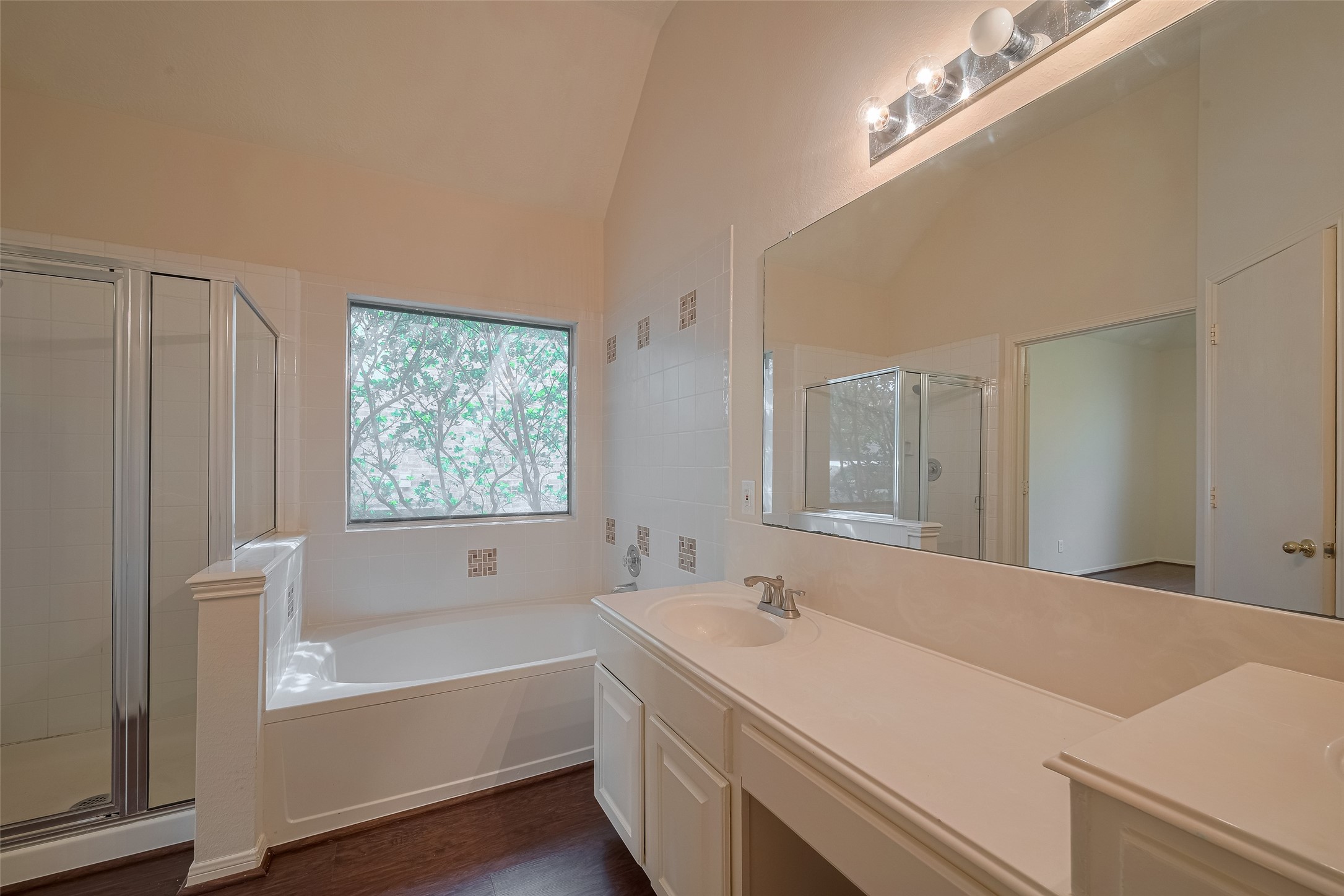 619 Bending Bough Drive Spring, TX 77388 - Photo 24 of 41 a bathroom with a tub a sink and a large mirror
