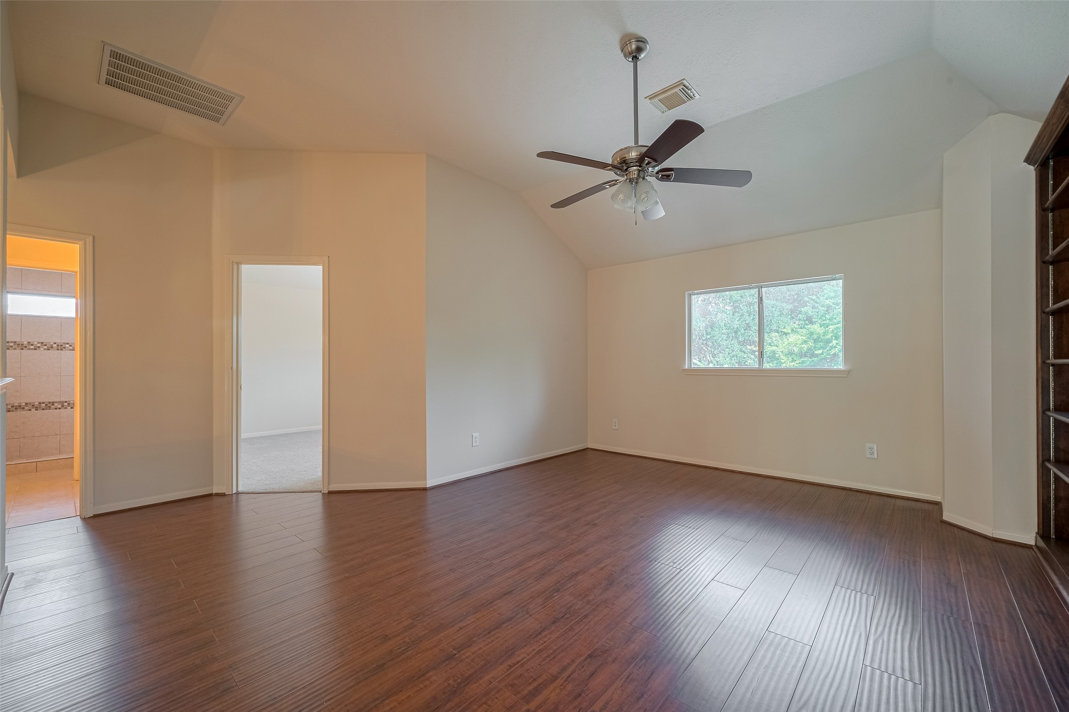 619 Bending Bough Drive Spring, TX 77388 - Photo 30 of 41 a view of an empty room with wooden floor and a window