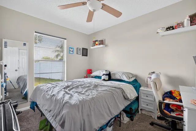a bedroom with a bed and dresser