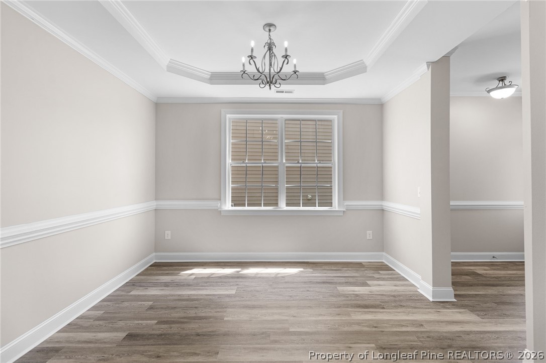 50 Huzzas Circle Cameron, NC 28326 - Photo 8 of 39 a view of empty room with wooden floor and fan