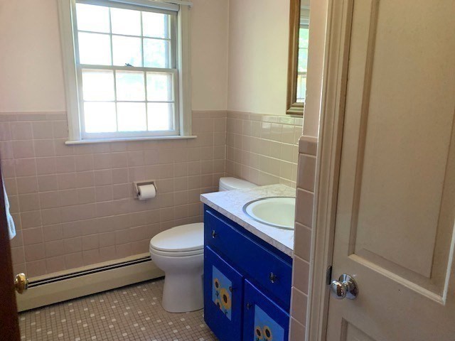 72 Bailey Lane Georgetown, MA 01833 - Photo 11 of 29 a bathroom with a sink a toilet and window