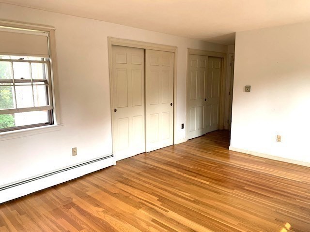 72 Bailey Lane Georgetown, MA 01833 - Photo 14 of 29 a view of empty room with wooden floor and fan