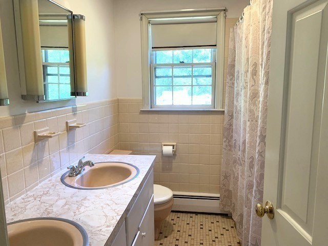 72 Bailey Lane Georgetown, MA 01833 - Photo 15 of 29 a bathroom with a sink a toilet and shower