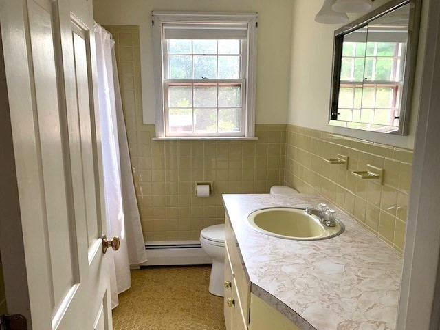 72 Bailey Lane Georgetown, MA 01833 - Photo 16 of 29 a bathroom with a granite countertop sink a toilet and a mirror