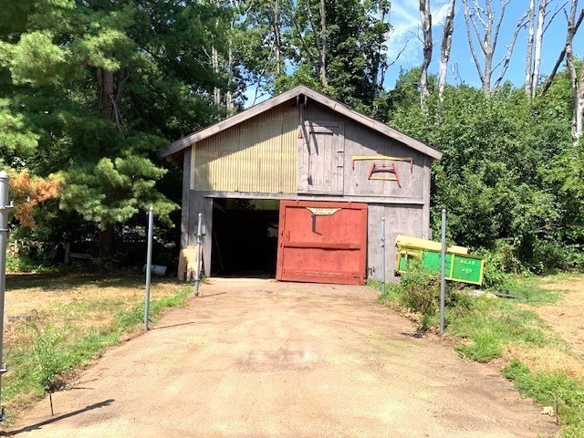 72 Bailey Lane Georgetown, MA 01833 - Photo 26 of 29 a front view of a house with a yard and garage