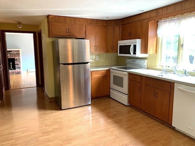 72 Bailey Lane Georgetown, MA 01833 - Photo 6 of 29 a kitchen with stainless steel appliances a refrigerator sink and microwave