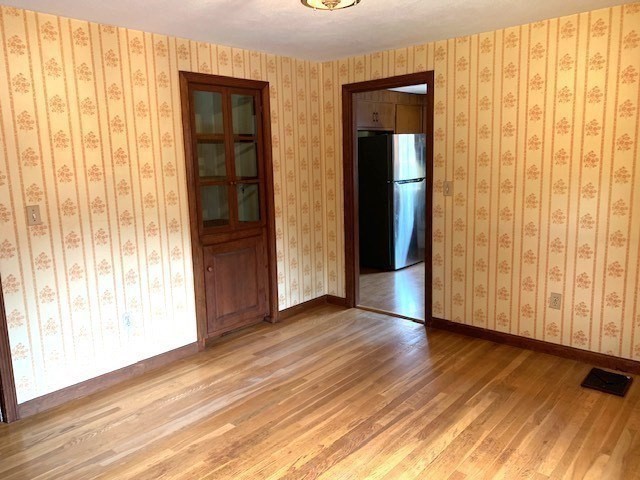 72 Bailey Lane Georgetown, MA 01833 - Photo 10 of 29 a view of wooden floor and windows in a room