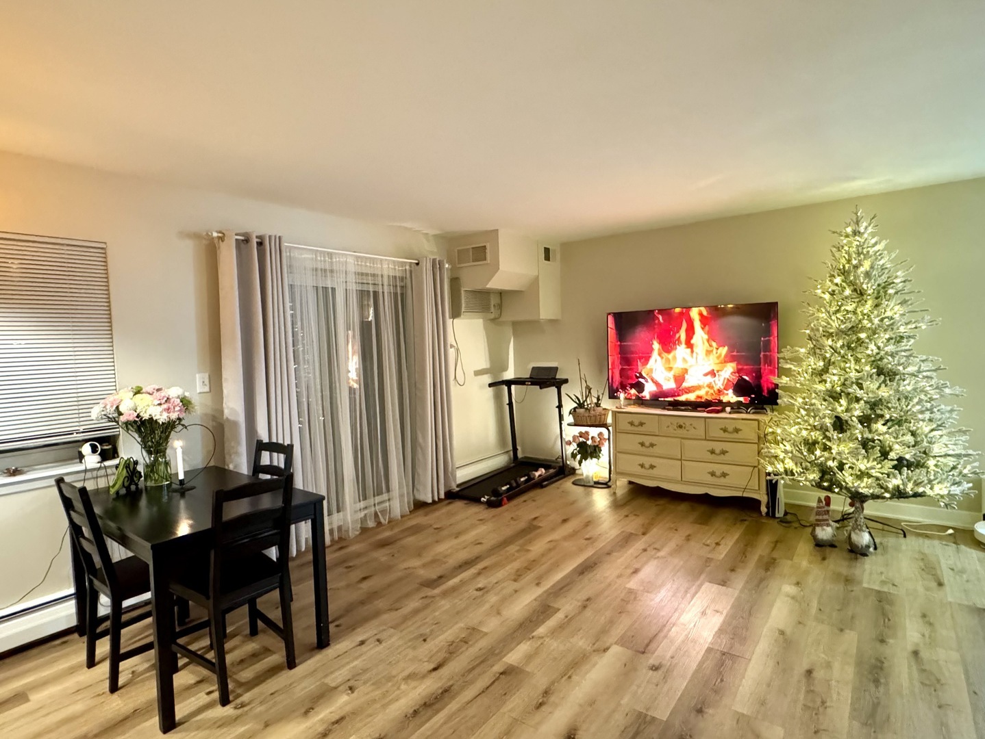 535 South Cleveland Avenue, Unit 101 Arlington Heights, IL 60005 - Photo 2 of 10 a living room with furniture and a flat screen tv