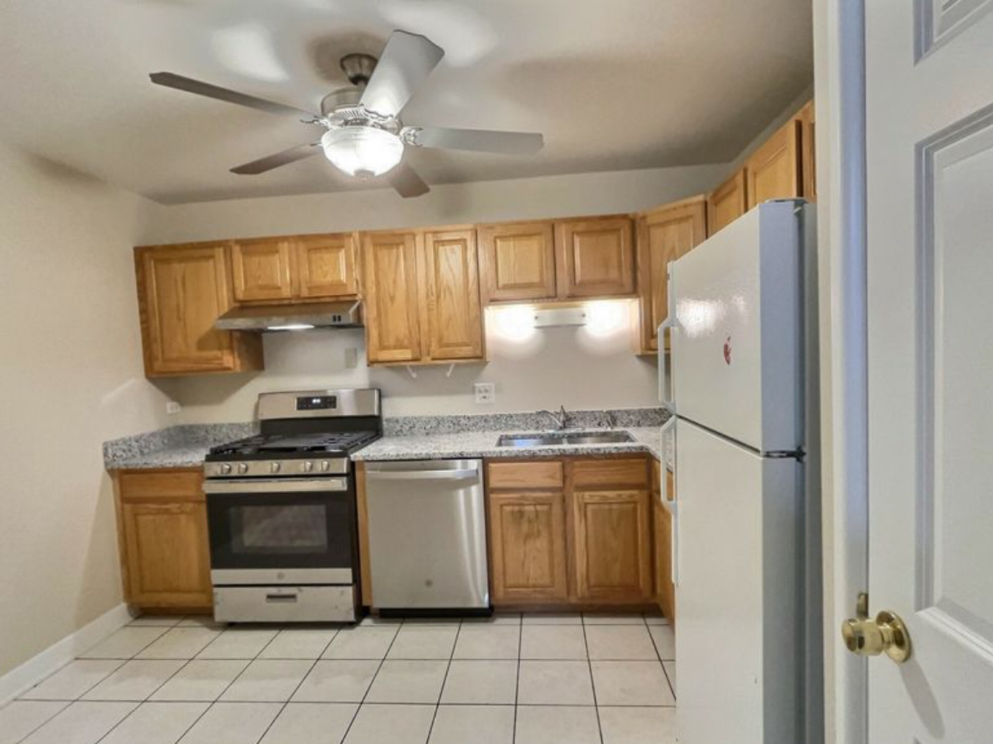 535 South Cleveland Avenue, Unit 101 Arlington Heights, IL 60005 - Photo 5 of 10 a kitchen with stainless steel appliances granite countertop a stove a refrigerator and a sink