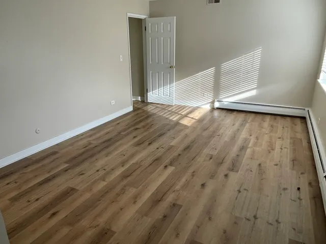 a view of outdoor space with wooden floor