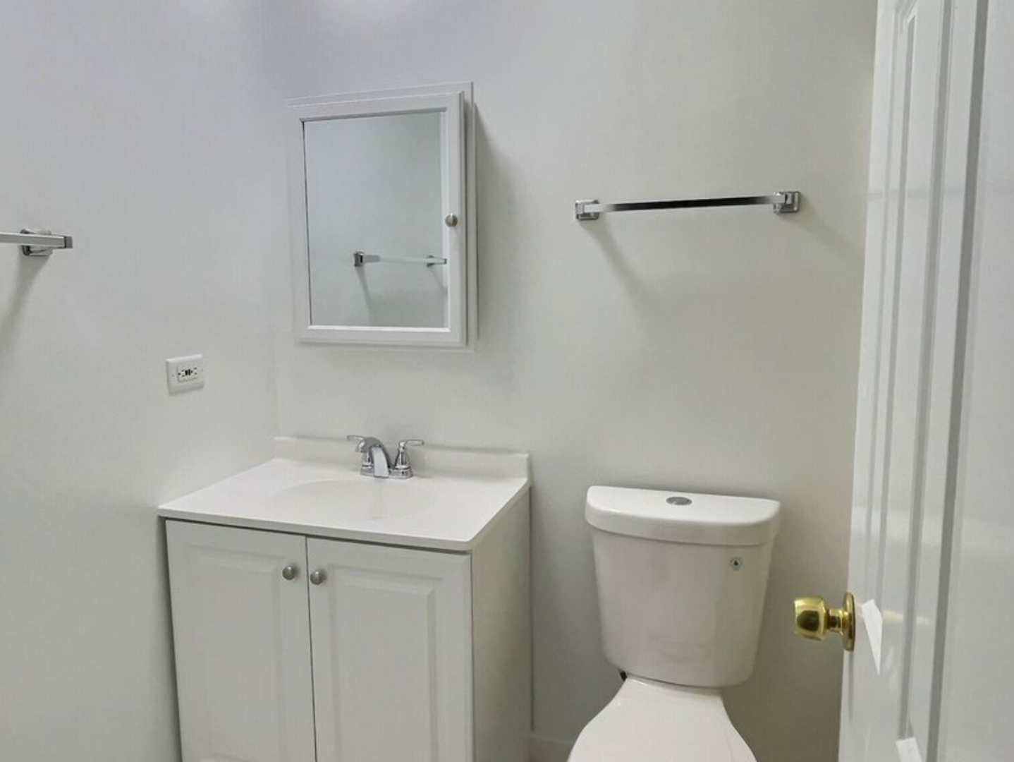 535 South Cleveland Avenue, Unit 101 Arlington Heights, IL 60005 - Photo 9 of 10 a white toilet sitting next to a bathroom sink