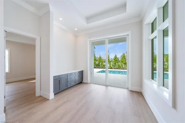 a view of room with window and wooden floor