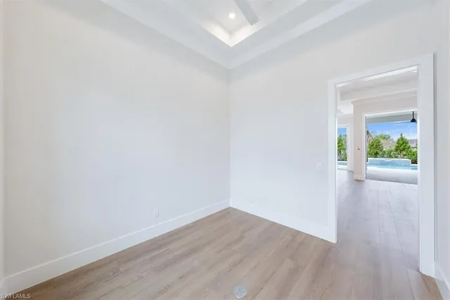 a view of an empty room and wooden floor