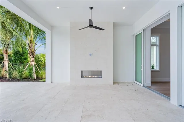 an empty room with windows and outdoor view