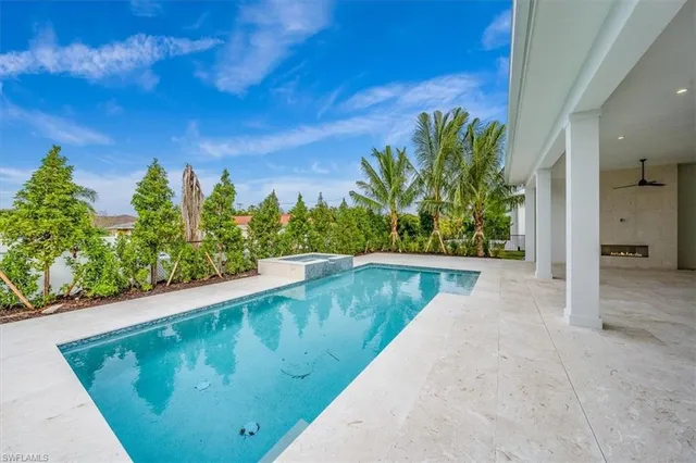 a view of a swimming pool with a yard